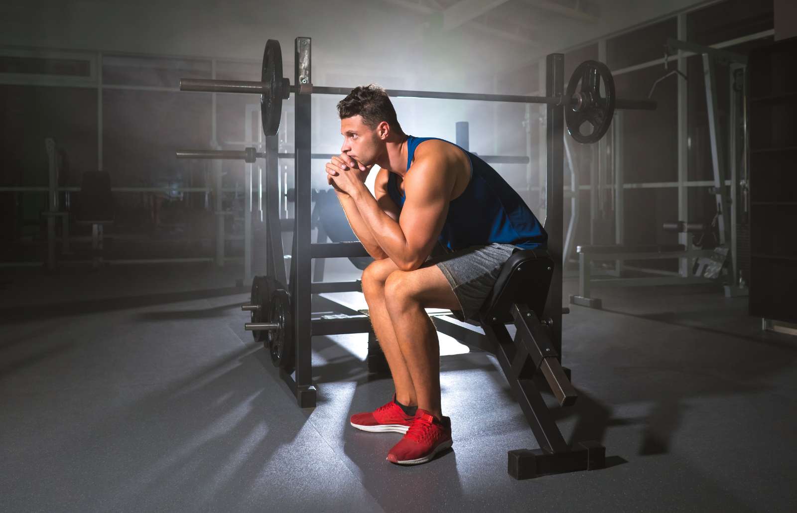 The tired sportsman sit in the sport center