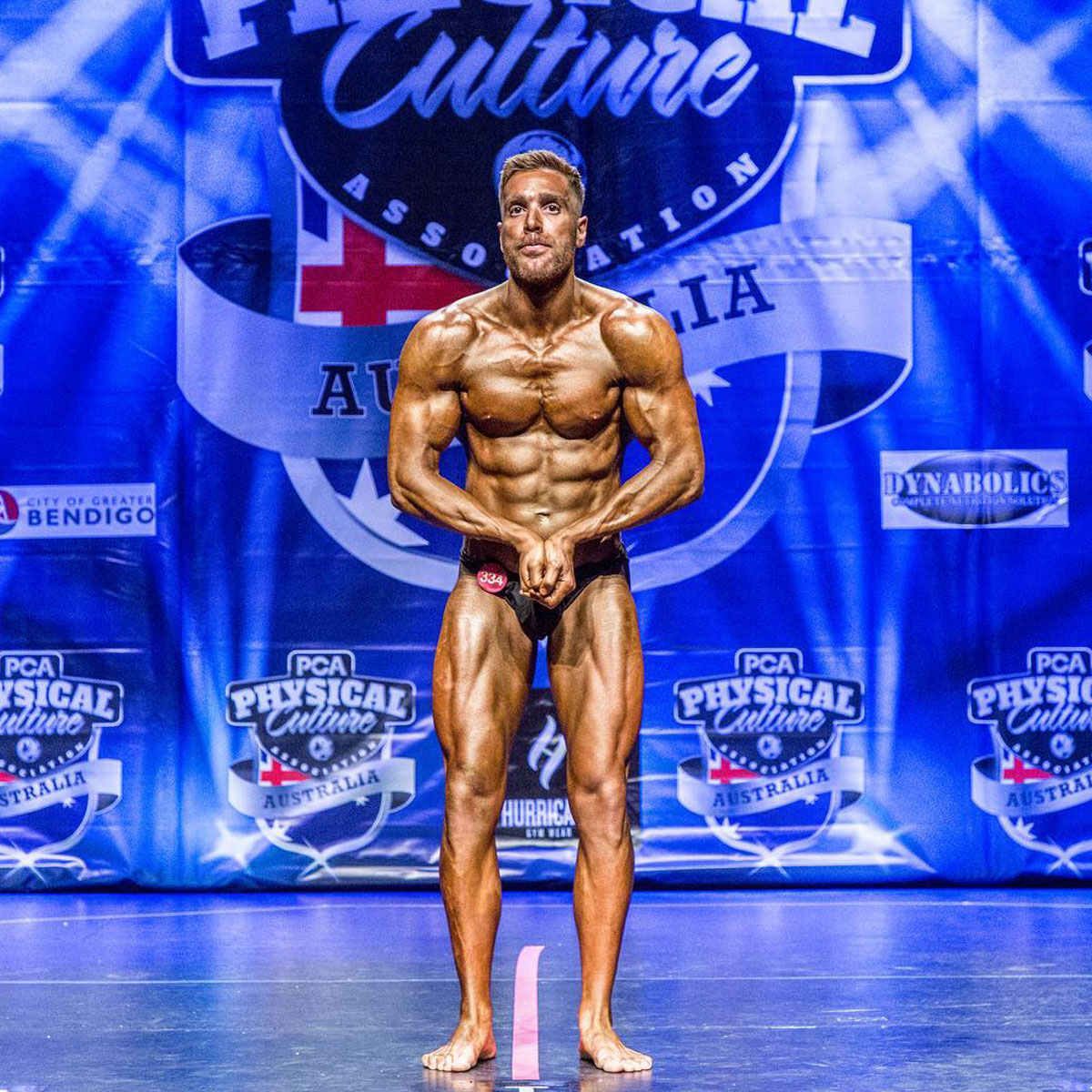 Strength Lab client at PCA event displaying final stage physique