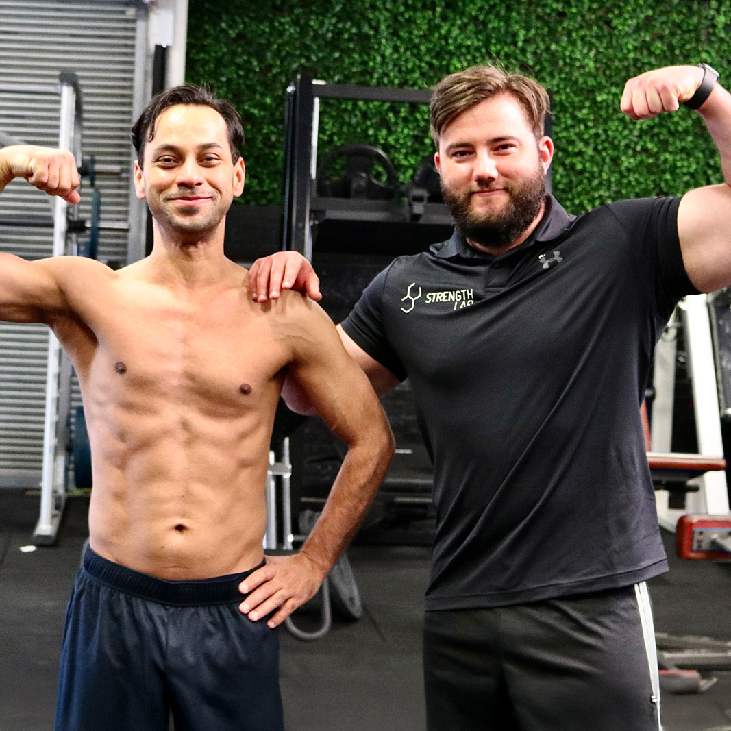 Male client working on fat loss with personal trainer guidance at Strength Lab