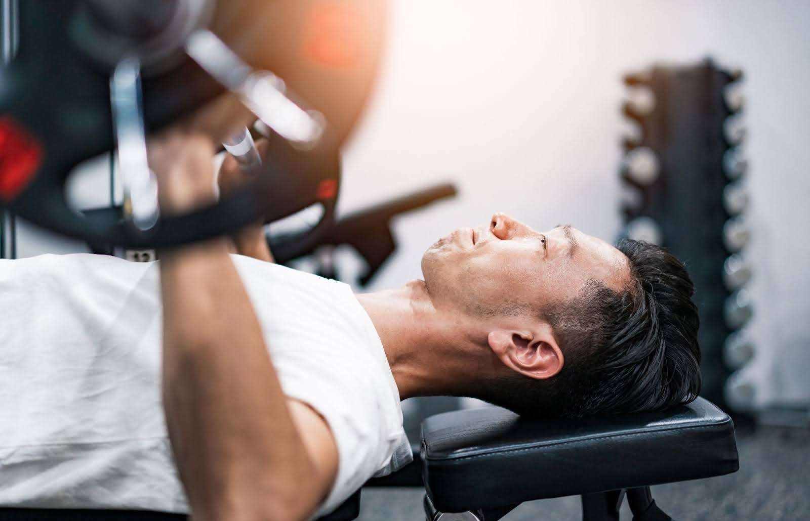 Man lifting weights at a gym